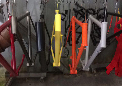 A variety of bicycle chassis hanged dry by Tallaght Powder Coating Ltd.