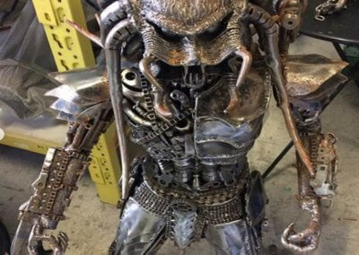 A collectible item Alien Predator being restored by TPC
