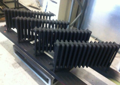 Motorbike parts in black matte paint by Tallaght Powder Coating