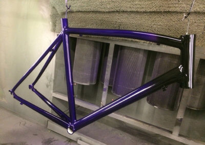A bicycle chassis painted in purple at Tallaght Powder Coating