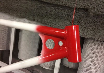 A closeup of bicycle body painted in red and white color