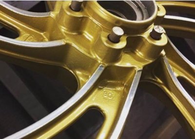 Alloy wheels in yellow gold paint by Tallaght Powder Coating