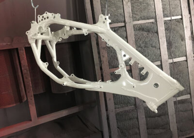White chassis of a motorbike restored by Tallaght Powder Coating