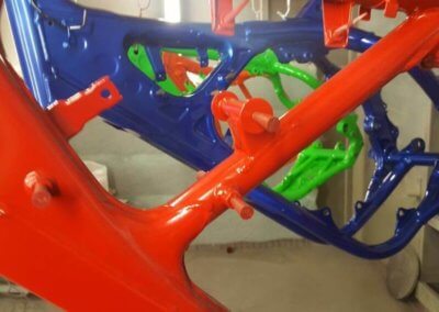 Colorful chassis aligned for painting and coating services by Tallaght Powder Coating Ltd.