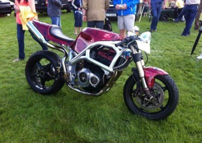A motorcycle in purple body and silver chassis restored by Tallaght Powder Coating