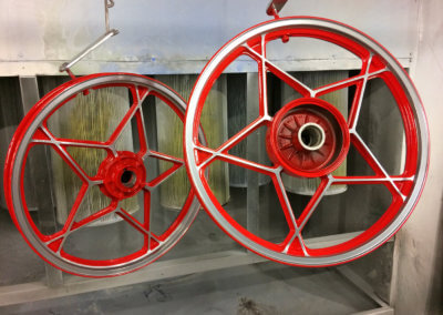 Mag wheels with star design painted in red by Tallaght Powder Coating