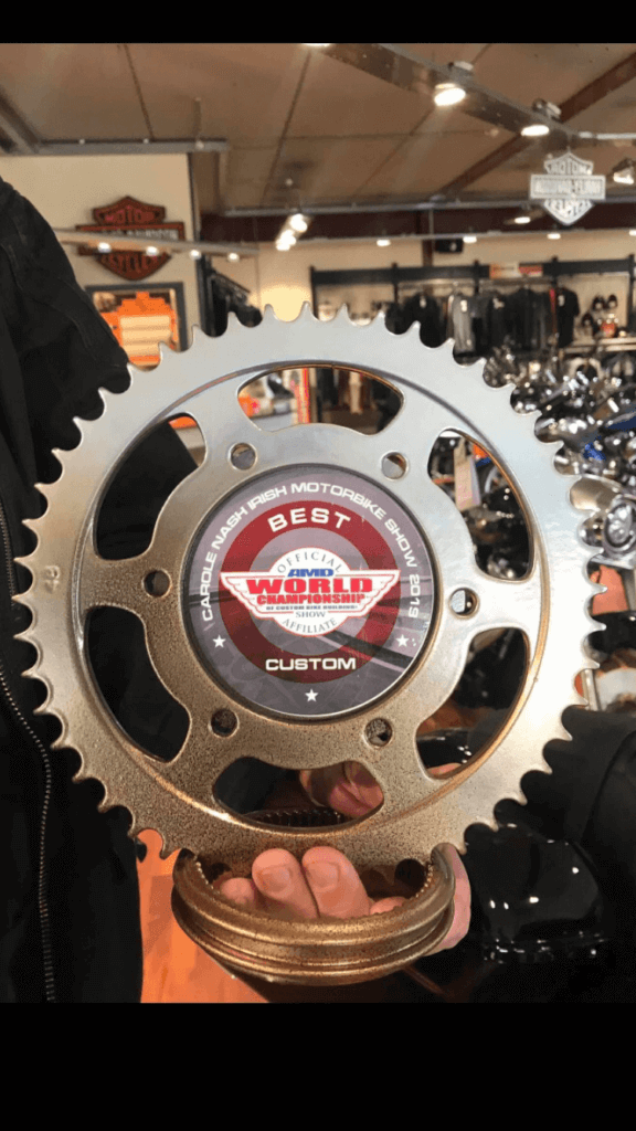 Upcycled motorcycle sprocket clock designed like a trophy