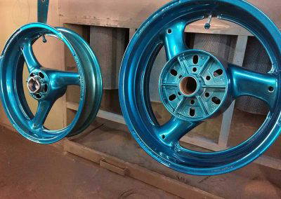 Powder coated alloy wheels in metallic blue finish at Tallaght Powder Coating Dublin