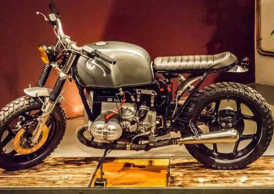 Custom BMW motorcycle with grey fuel tank and black powder coated alloy wheels