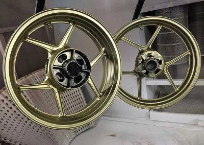Gold powder coated alloy wheels for motorcycles by Tallaght Powder Coating Dublin